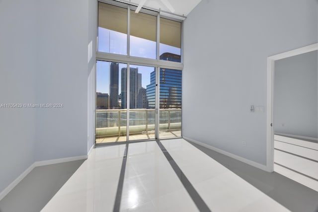 spare room with a high ceiling