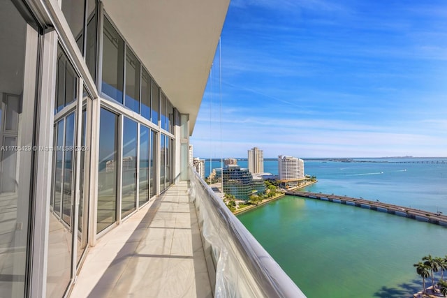 balcony featuring a water view