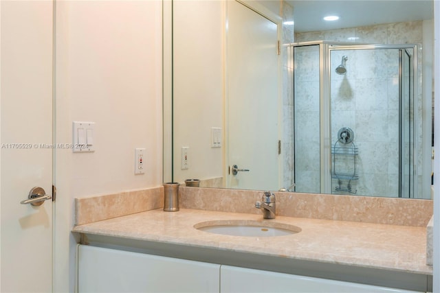 bathroom with vanity and walk in shower