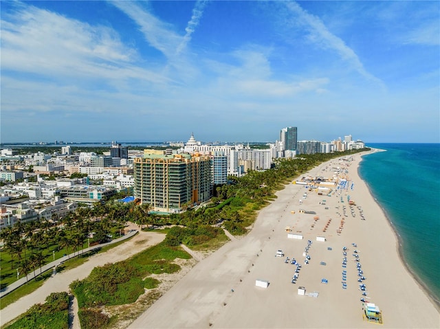 bird's eye view with a beach view and a water view