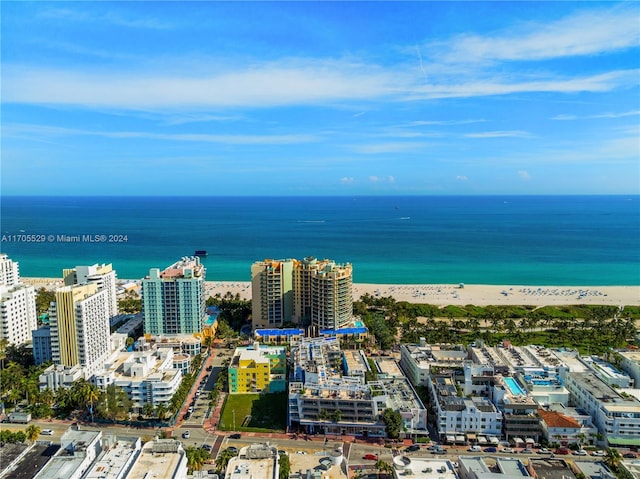 bird's eye view featuring a beach view and a water view