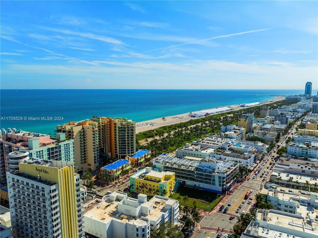 bird's eye view with a water view and a view of the beach