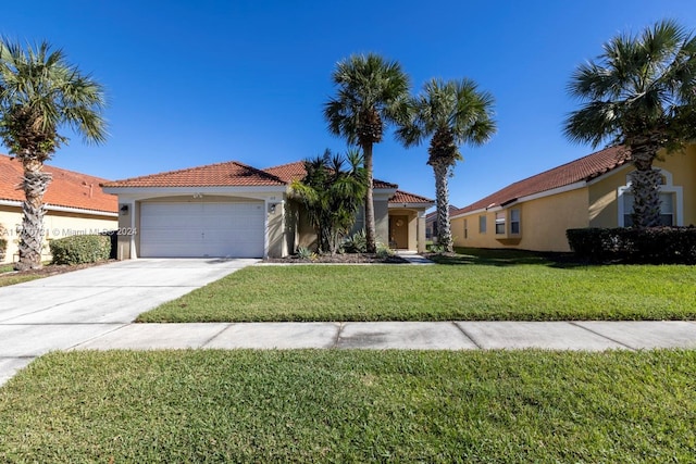 view of front of house with a front yard and a garage