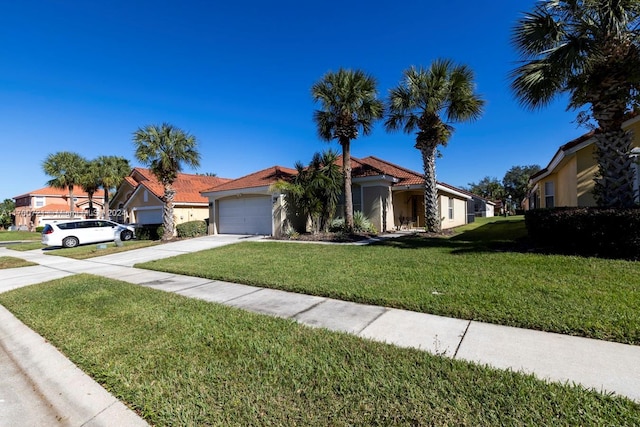 view of front of property with a front lawn and a garage