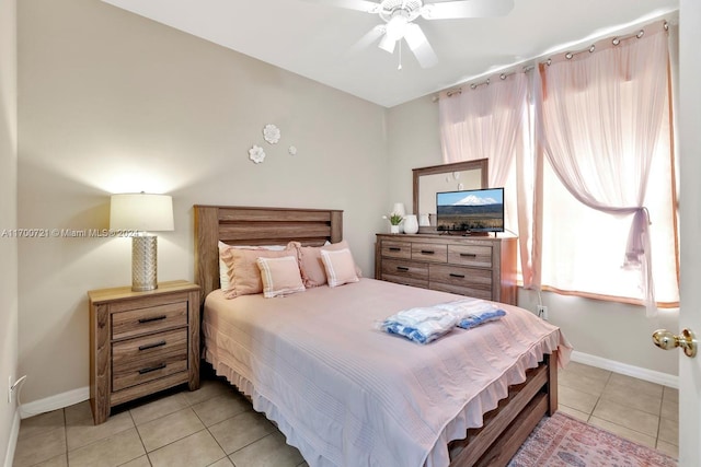 bedroom with ceiling fan and light tile patterned floors