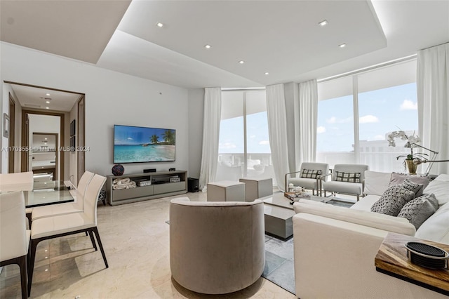 living room featuring expansive windows and a healthy amount of sunlight