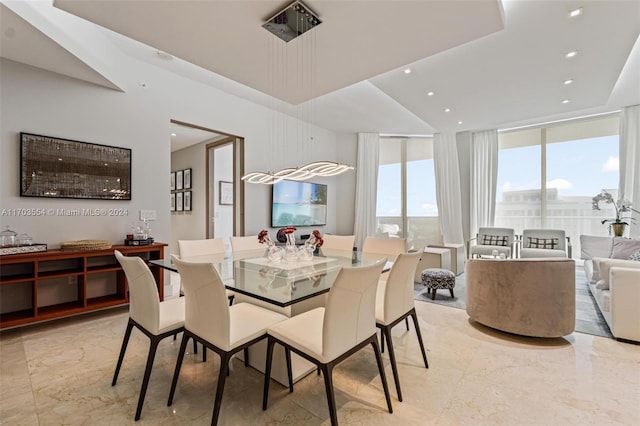 dining area featuring floor to ceiling windows