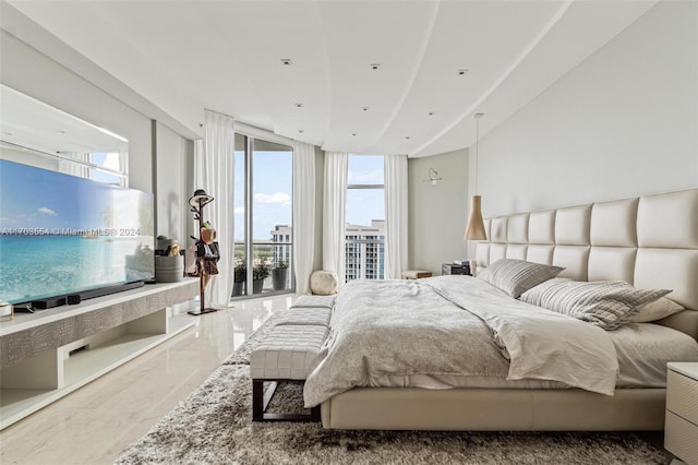 bedroom with access to outside and expansive windows