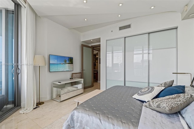 bedroom with a closet and lofted ceiling