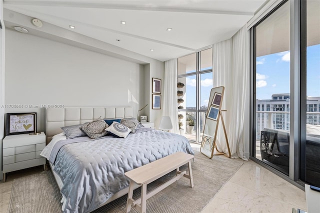 bedroom featuring a wall of windows