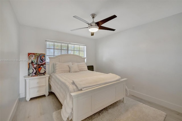 bedroom featuring light wood-type flooring and ceiling fan