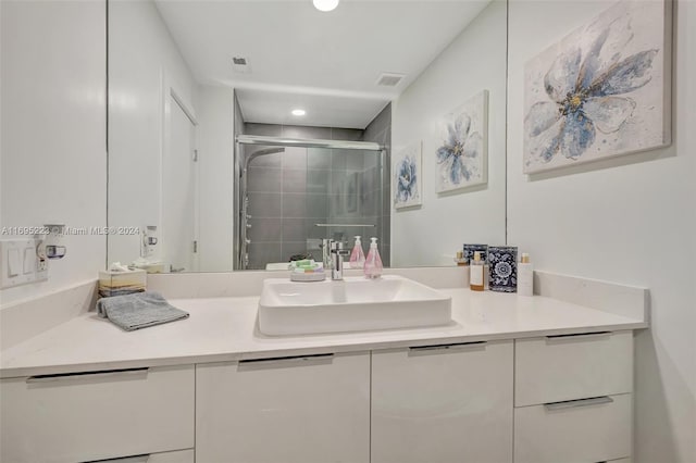 bathroom with vanity and walk in shower