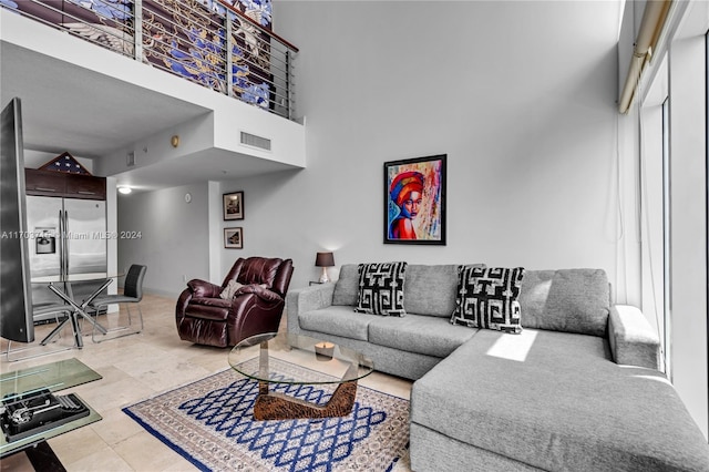 living room with a towering ceiling