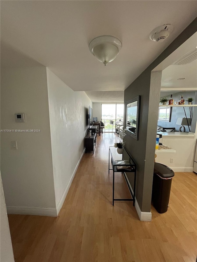 corridor featuring light hardwood / wood-style floors