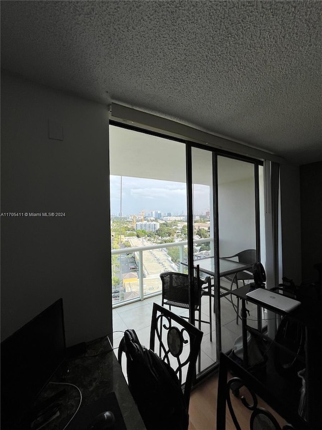 13499 Biscayne Blvd Unit 1601, North Miami, FL 33181 - dining space featuring a textured ceiling, floor to ceiling windows, and a view of city