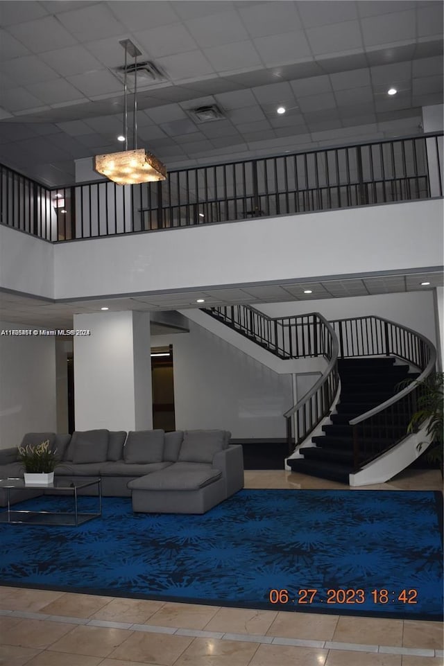 13499 Biscayne Blvd Unit 1601, North Miami, FL 33181 - common area featuring a high ceiling, stairway, and a drop ceiling