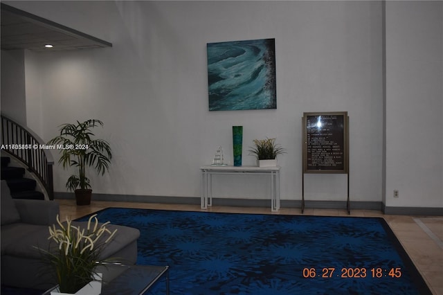 13499 Biscayne Blvd Unit 1601, North Miami, FL 33181 - living room featuring stairway and baseboards