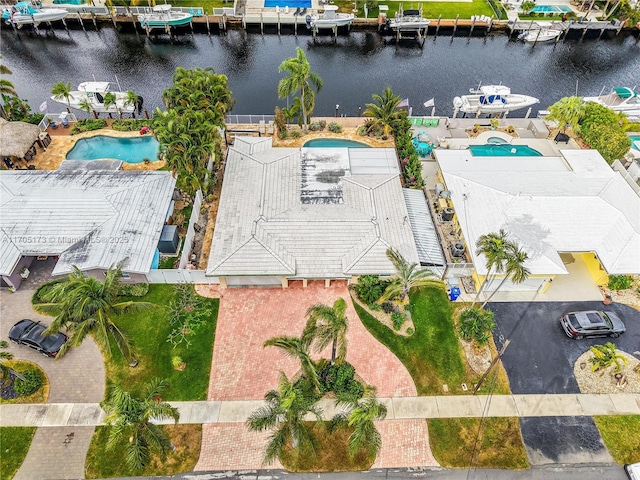 birds eye view of property with a water view