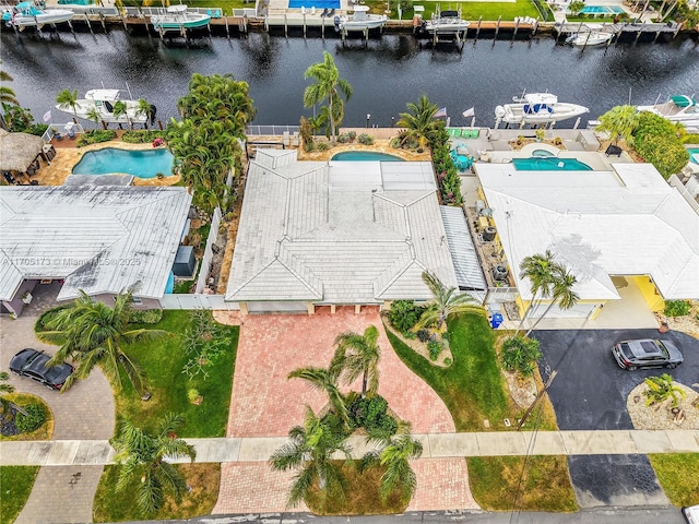 birds eye view of property featuring a water view