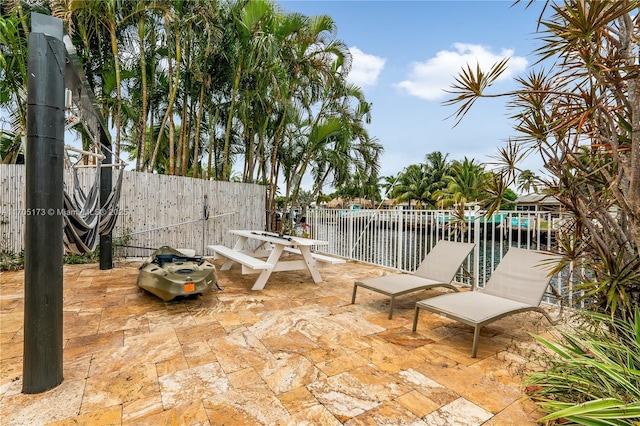 view of patio with a water view