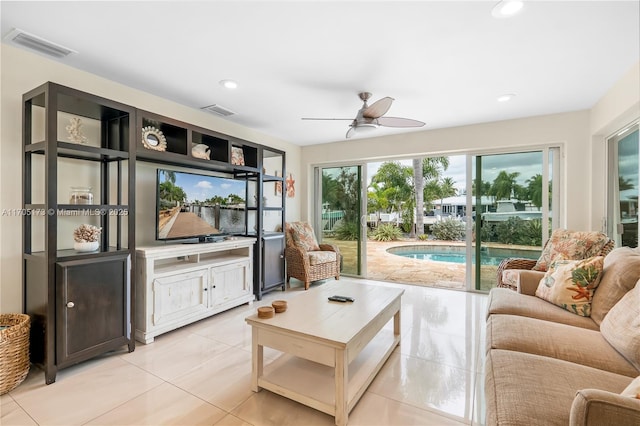 living area with recessed lighting, visible vents, ceiling fan, and light tile patterned floors