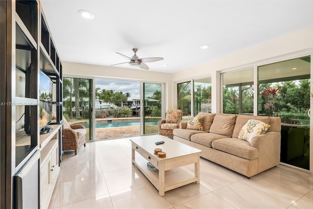 sunroom featuring a ceiling fan