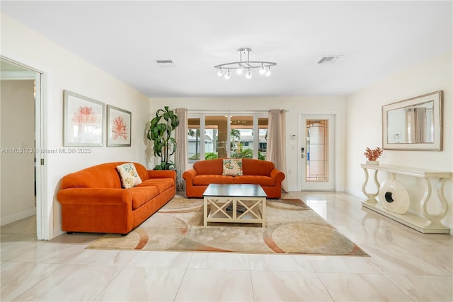 living room featuring a notable chandelier