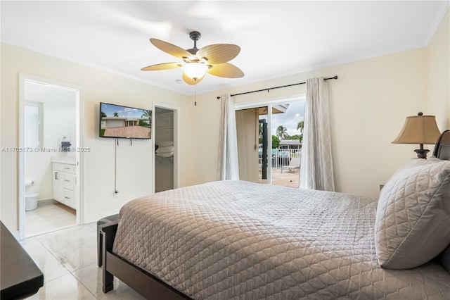 bedroom featuring ceiling fan, connected bathroom, a closet, access to exterior, and a walk in closet