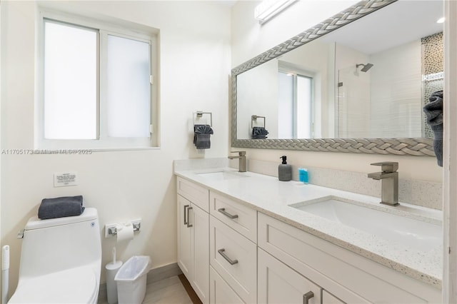 full bath featuring a sink, toilet, double vanity, and a tile shower