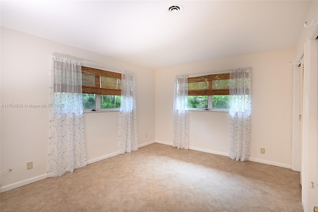 spare room featuring plenty of natural light