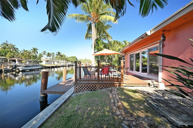 view of dock featuring a deck with water view