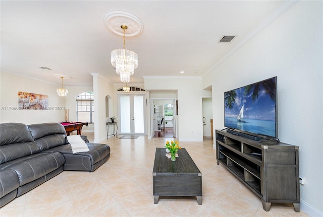 tiled living room featuring crown molding, an inviting chandelier, billiards, and french doors