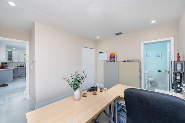 office with a textured ceiling