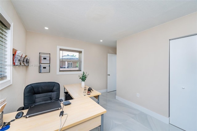 home office with a textured ceiling