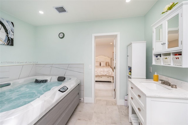 bathroom featuring tile patterned floors and vanity