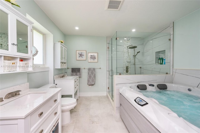 full bathroom featuring separate shower and tub, toilet, and vanity