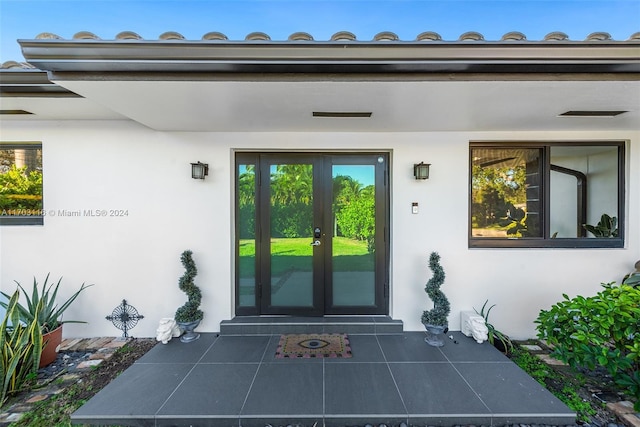 property entrance featuring french doors