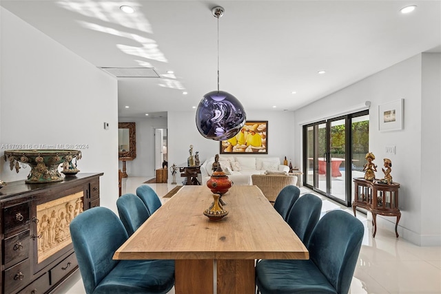 tiled dining room featuring french doors