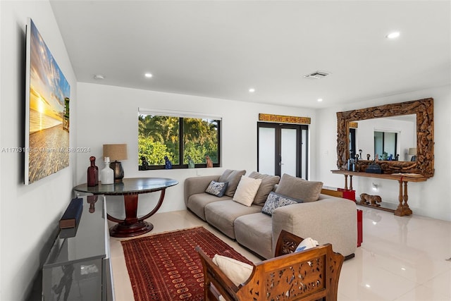 tiled living room featuring french doors