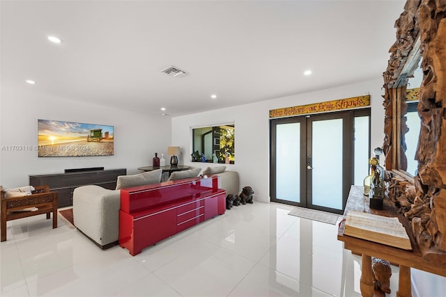 tiled living room featuring french doors and a healthy amount of sunlight