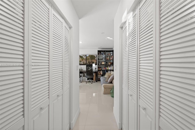 corridor with light tile patterned flooring