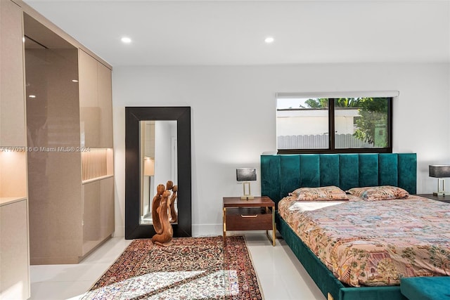 bedroom with light tile patterned flooring