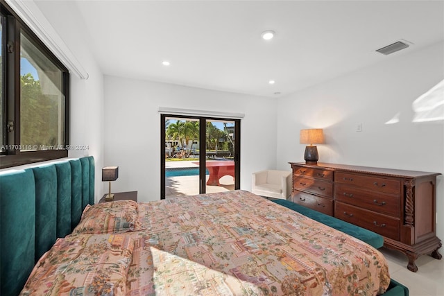 bedroom with access to exterior and light tile patterned floors