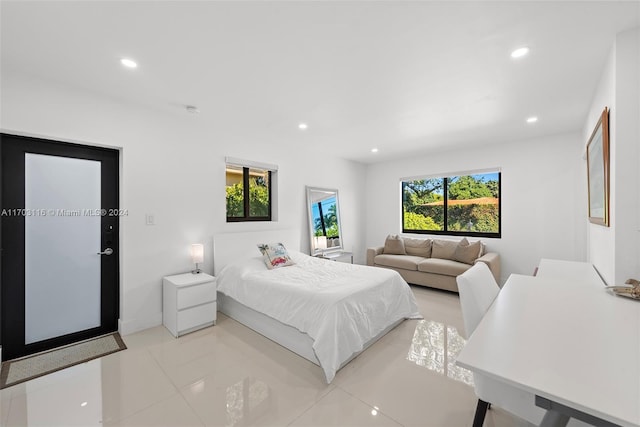 bedroom with light tile patterned floors