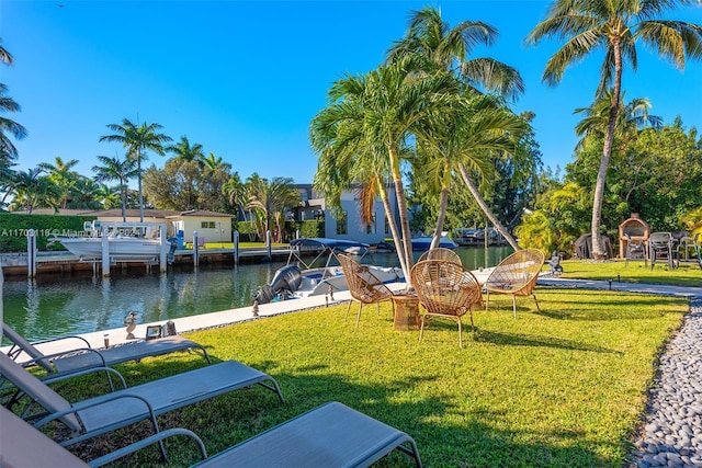 view of dock featuring a water view and a lawn