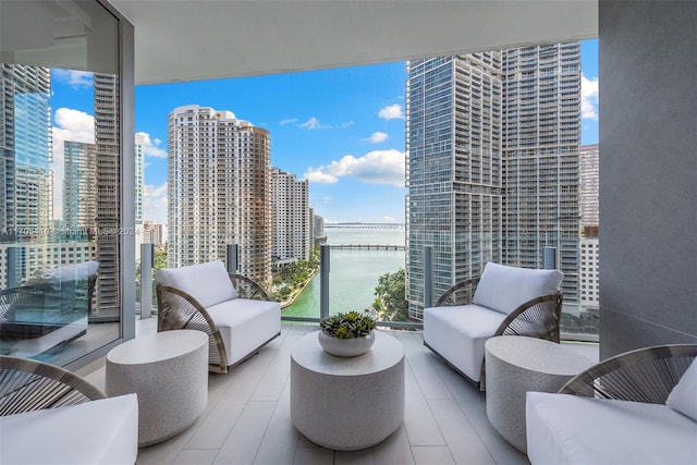 balcony featuring a water view