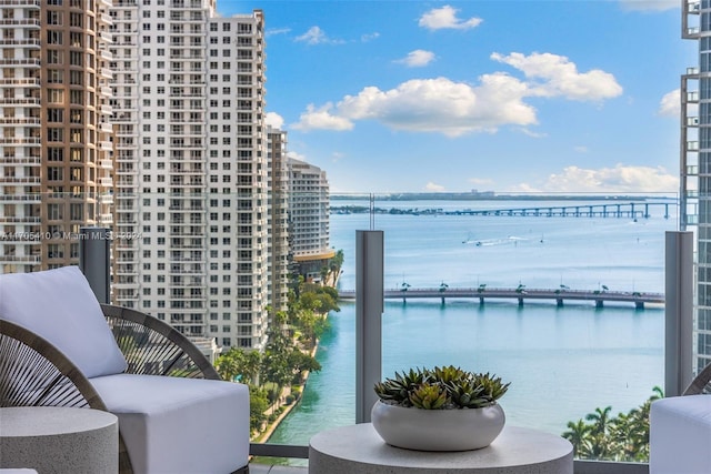 balcony featuring a water view