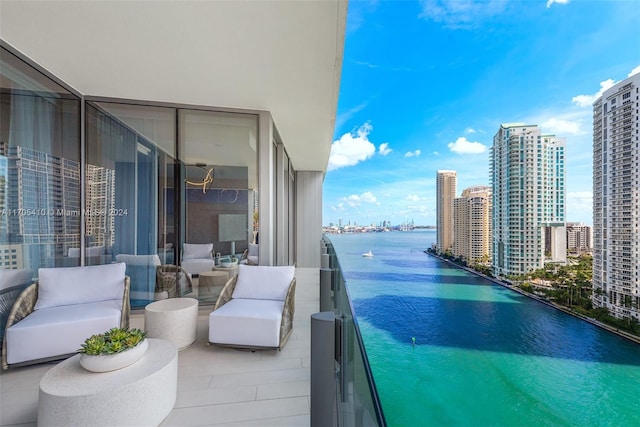 balcony featuring a water view