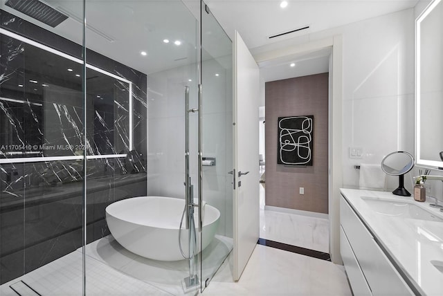 bathroom featuring tile patterned floors, vanity, and independent shower and bath