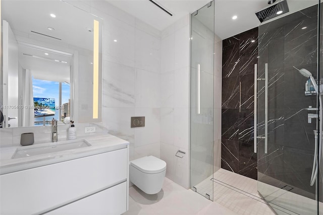 bathroom featuring vanity, tile patterned floors, toilet, tiled shower, and tile walls